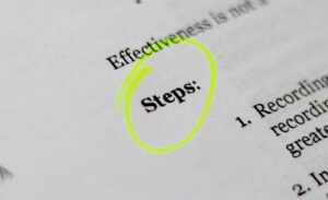 Automotive-sales-objection-handling-scripts - proactive training solutions Close-up of a document with the word 'steps:' circled by a neon yellow highlighter.